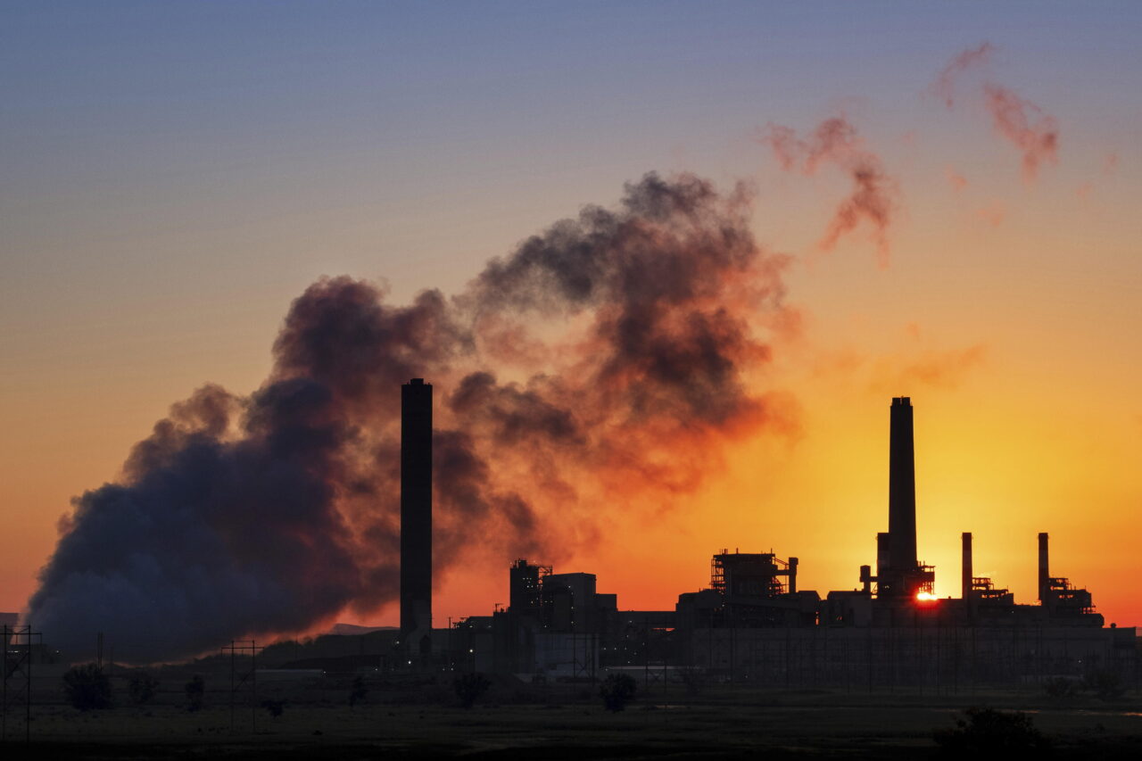 A coal-fired power plant is silhouetted against the morning sun on July 27, 2018, in Glenrock, Wyo. President Joe Biden unleashed a flurry of election-year rules on the environment and other topics, including a landmark regulation that would force coal-fired power plants to capture smokestack emissions or shut down.