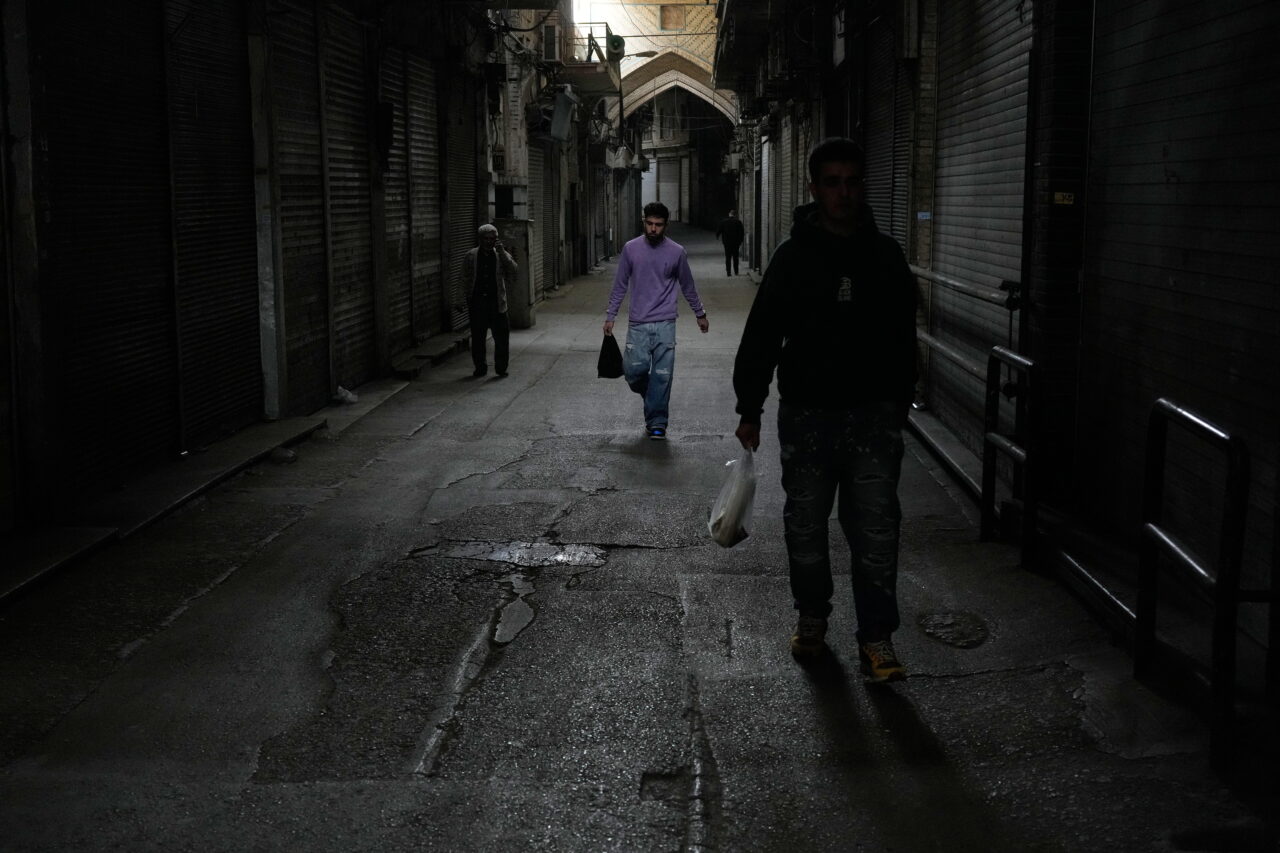 People walk past closed shops at the nearly empty traditional main bazaar during Iranian New Year, or Nowruz, holidays in Tehran, Iran, March 29, 2026.