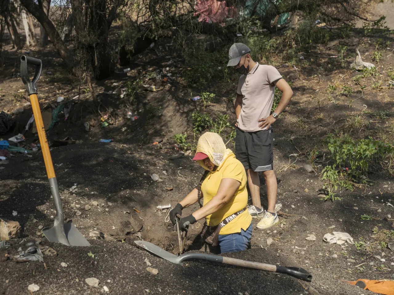 About 100,000 people are missing in Mexico. These mothers are trying to find them 5 Virginia Ponce nails a metal piece of iron into a hole. She is looking to find any remains of a human body in it. on Tlahuac, Mexico City, May 28, 2024.