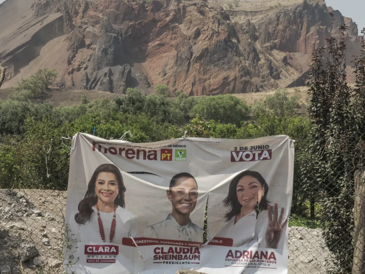 About 100,000 people are missing in Mexico. These mothers are trying to find them 6 View of Mexican presidential propaganda, in the background the Xaltepec volcano, in Tlahuac, Mexico City, where the group of "Mothers searching for the disappeared Sonora and Jalisco" claim to have found a clandestine oven for cremation of human remains. on Tlahuac, Mexico City, May 28, 2024.