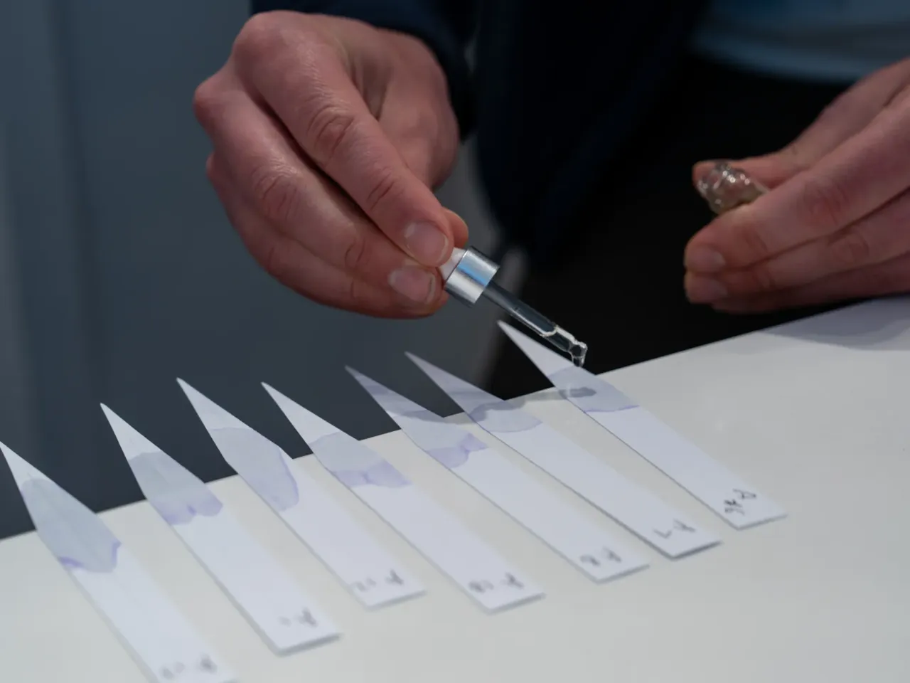 We designed a 'Morning Edition' fragrance – and learned why perfume sales are up 3 JJ Vittoria, CEO of Olfactory NYC, mixes multiple oils into strips of paper at their Georgetown location on Thursday May 16, 2024.