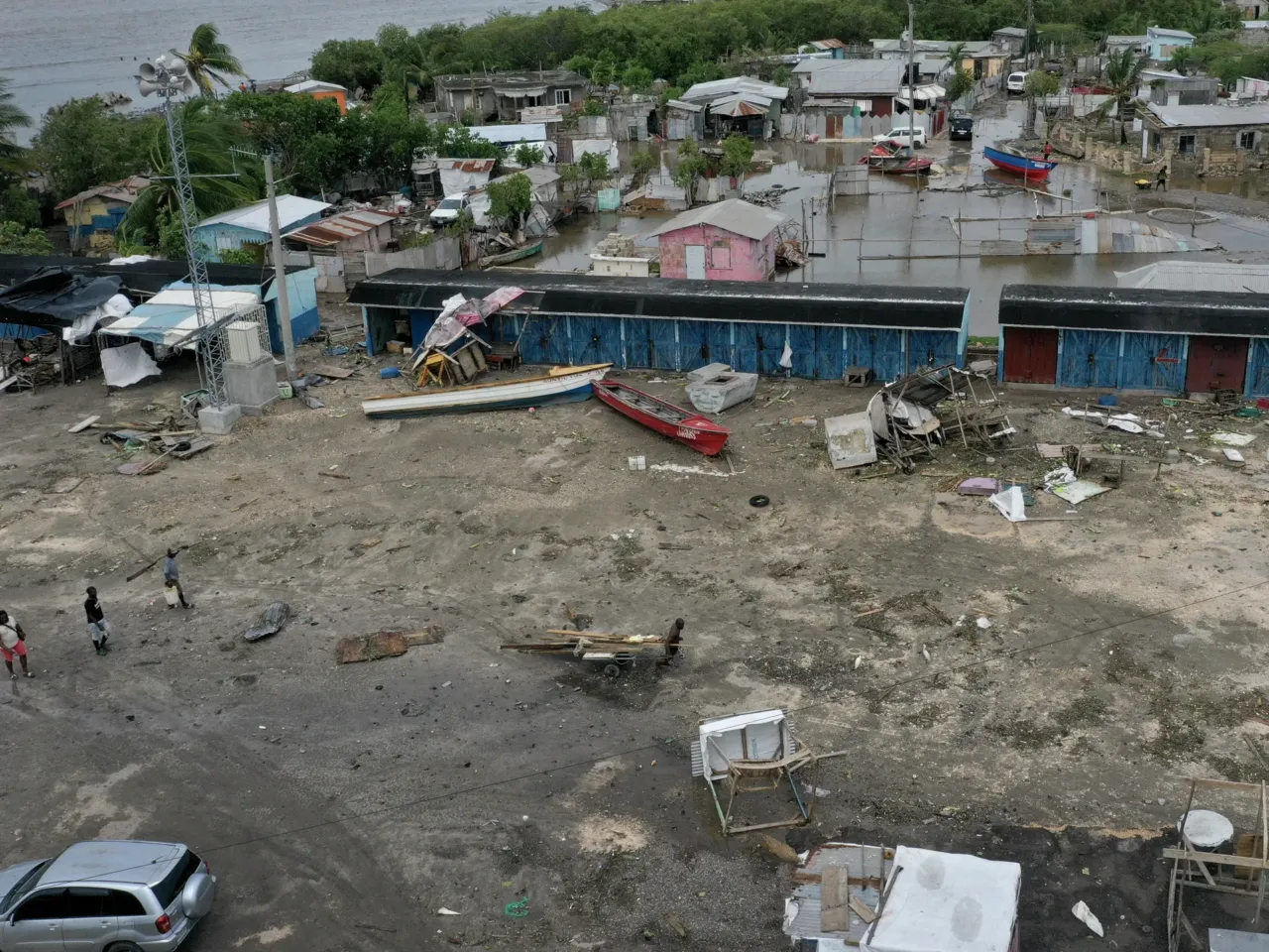 In an aerial view, people in a fishing village recover after Hurricane Beryl passed through the area on July 04, 2024, in Old Harbor, Jamaica. Hurricane Beryl, now a Category 3 storm, continues toward Mexico after passing through Caribbean islands, including Jamaica.