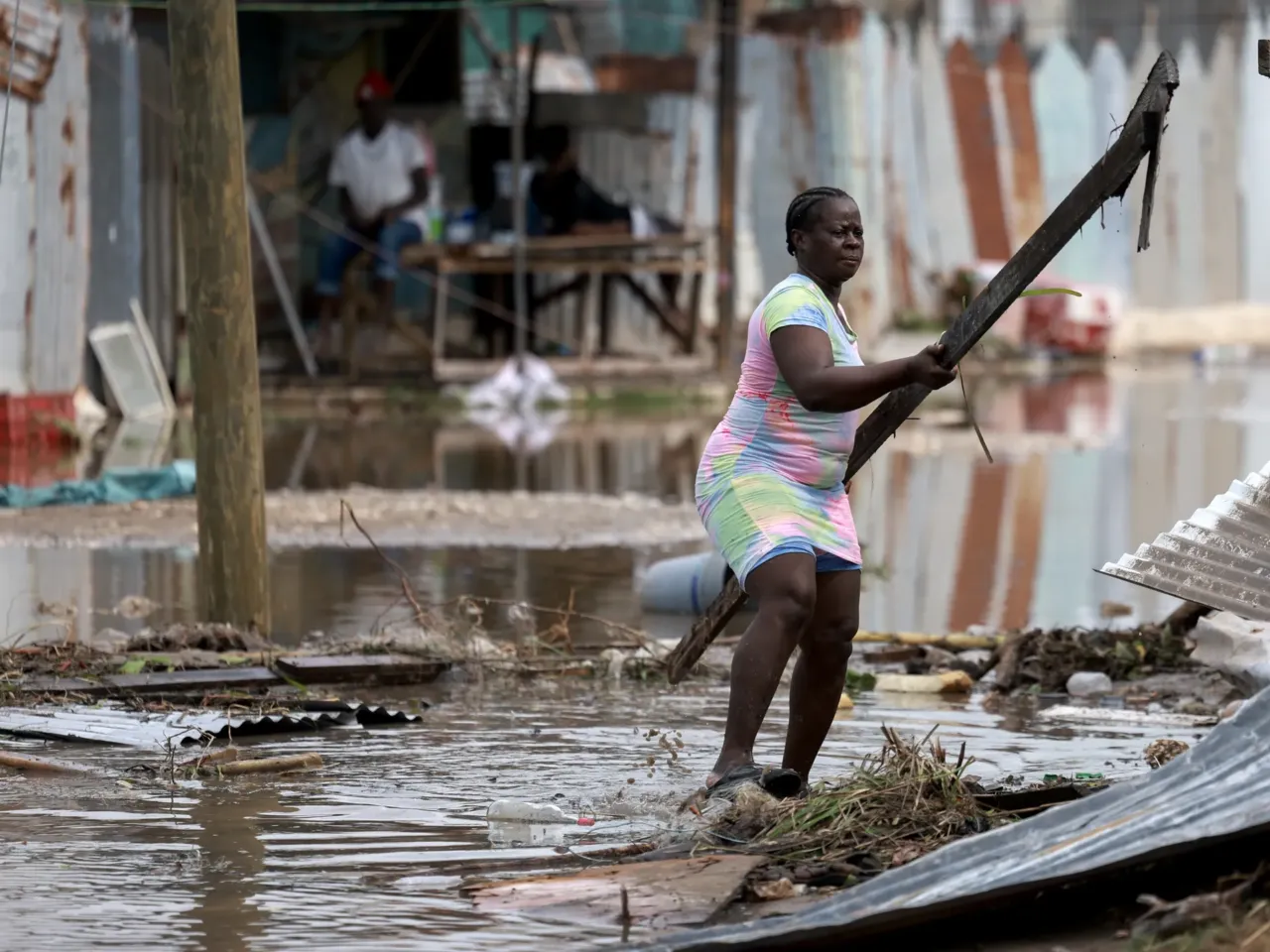 Simone Francis gathers items from her home that were blown away as Hurricane Beryl passed through the area on July 4, 2024 in Old Harbor, Jamaica. Hurricane Beryl continues toward Mexico after passing through Caribbean islands, including Jamaica.