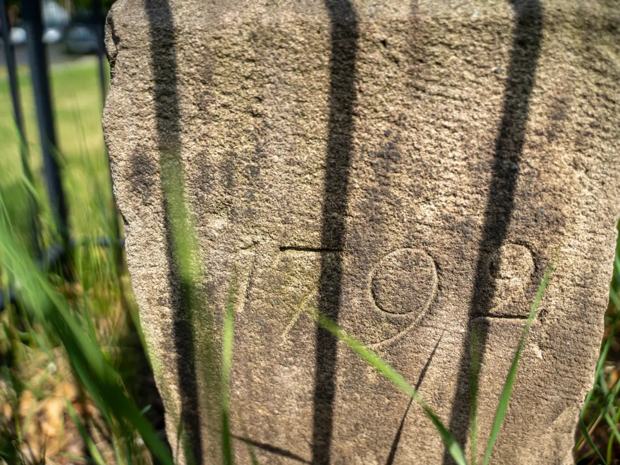 One face of each stone is carved with the year it was set in the ground, either 1791 or 1792.