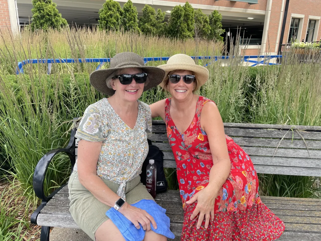 Nancy Lockhart (right) poses for a photo on a bench near the farmers market in Rochester, Mich. Lockhart says the debate reinforced her reservations about Biden's age and she is waiting for another candidate to run in his place.
