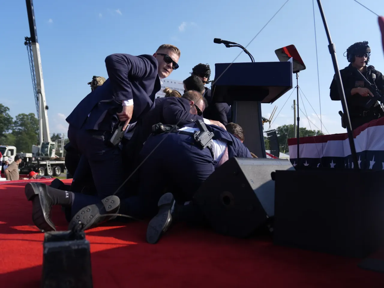 Photos: See how the Trump rally shooting unfolded 3 Republican presidential candidate former President Trump is surrounded by U.S. Secret Service agents.