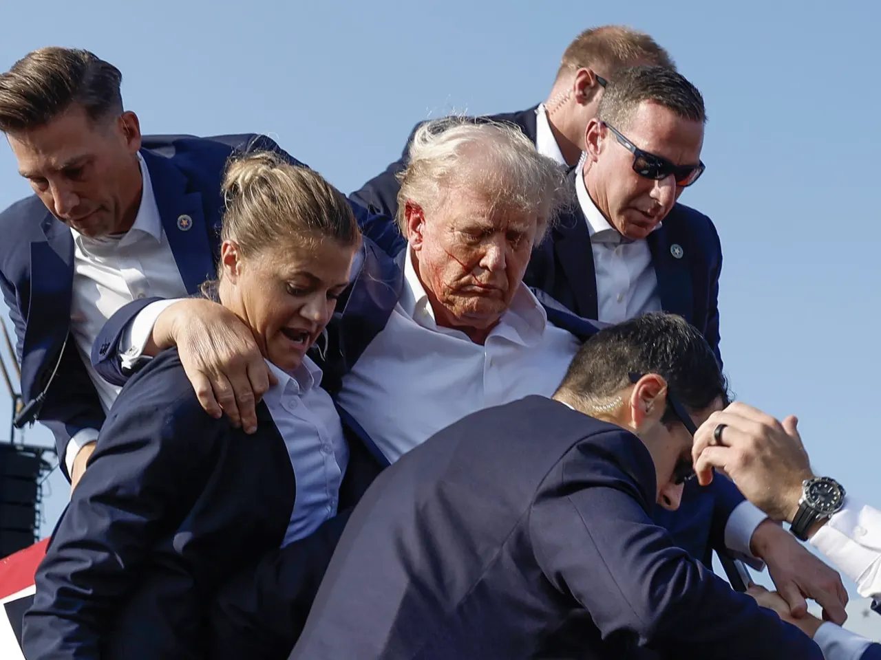 Photos: See how the Trump rally shooting unfolded 8 Republican presidential candidate former President Trump is rushed offstage by U.S. Secret Service agents after being grazed by a bullet.