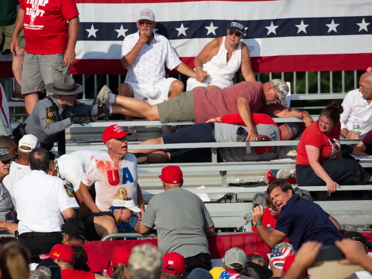Photos: See how the Trump rally shooting unfolded 9 Trump supporters are seen covered with blood in the stands after guns were fired at Republican candidate Trump.