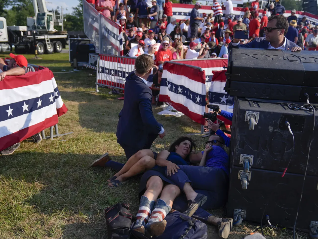 Photos: See how the Trump rally shooting unfolded 11 People react during a campaign rally with Republican presidential candidate former President Trump.