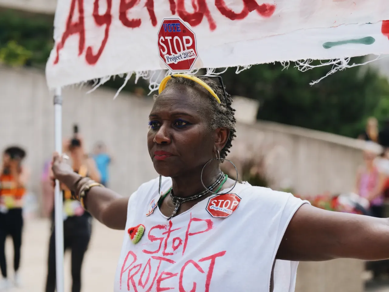 Nadine Seiler holds up a "Stop Project 2025" sign during the rally for March on RNC during the first day of the 2024 Republican National Convention in Milwaukee, Wisconsin, July 15, 2024.