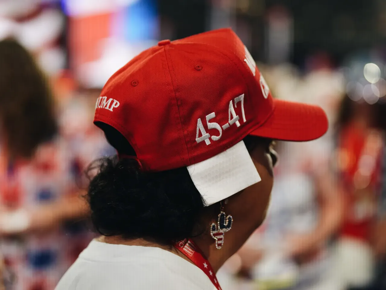 A delegate from Arizona, wears a gauze on her ear in solidarity with Donald Trump on the floor of the Republican National Convention.