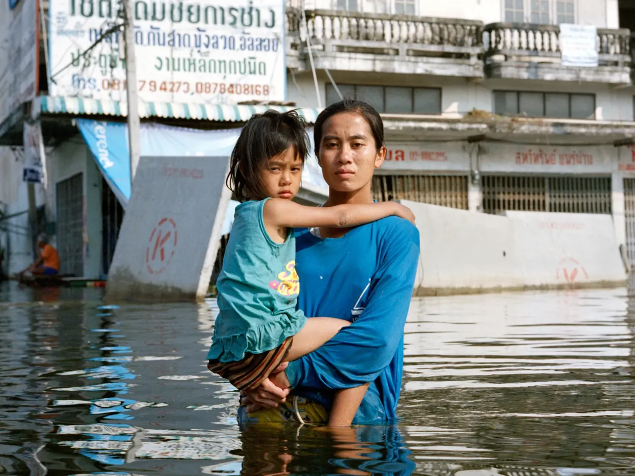 A flood of emotions in these stoic portraits of people returning home after a deluge 1 Anchalee Koyama. Taweewattana District, Bangkok, Thailand. November 2011.