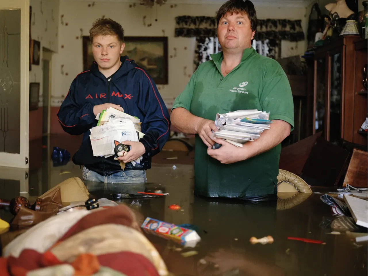 A flood of emotions in these stoic portraits of people returning home after a deluge 5 Graham Leith and his son, Kieran. Toll Bar, South Yorkshire, U.K. June 2007.