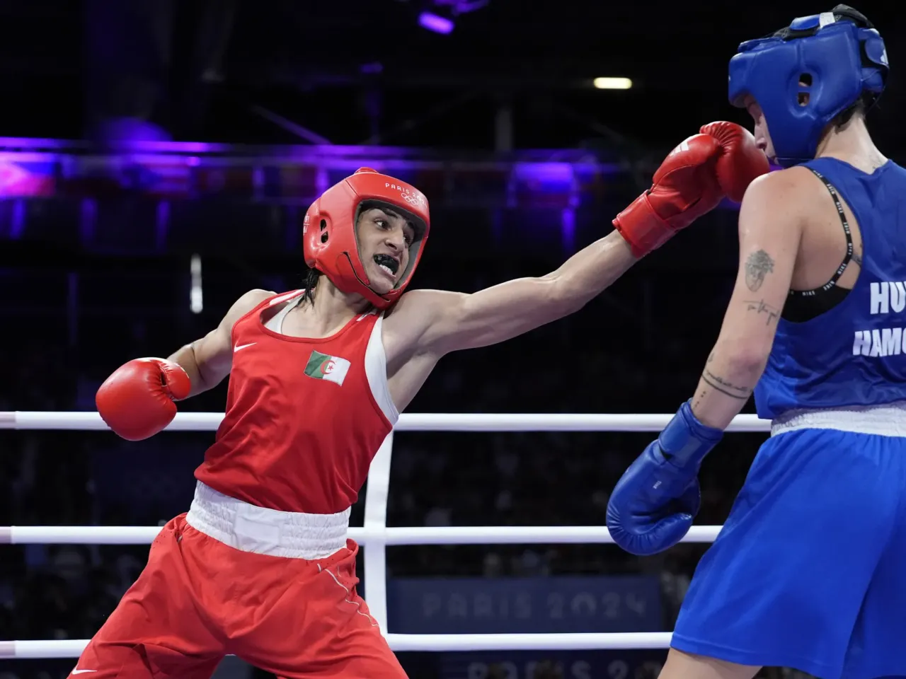 Algeria's Imane Khelif (left) hits Hungary's Anna Hamori in their women's 66kg quarterfinal boxing match at the 2024 Summer Olympics on Saturday in Paris.