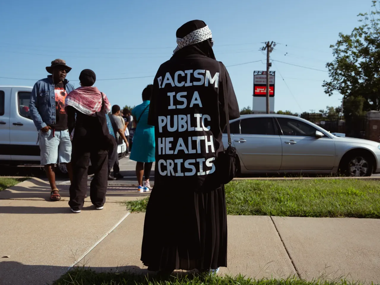 Adara Ameer, 19, of Florissant waits for unity march commemorating a decade after Michael Brown Jr.’s police killing in Ferguson.