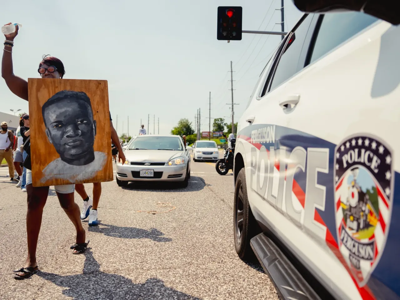 Clara Holmes, 55, of north St. Louis, makes her way to Canfield Drive.