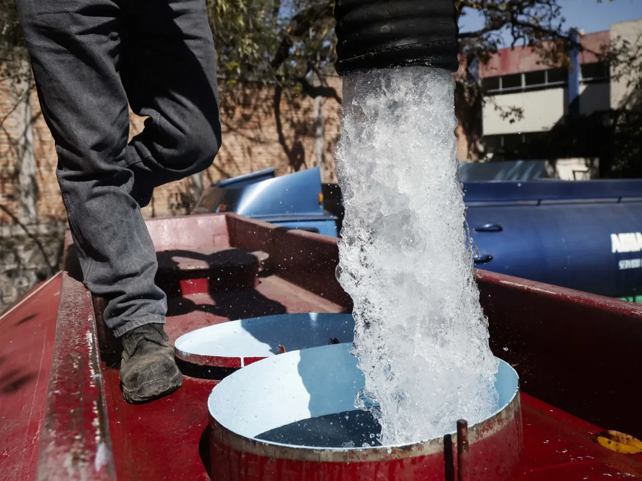 Water treaty between Mexico and U.S. faces biggest test in 80 years 3 A worker with Mexico's National Water Commission fills a water truck with drinking water to be distributed in Mexico City in January 2024 after the city experienced water shortages.