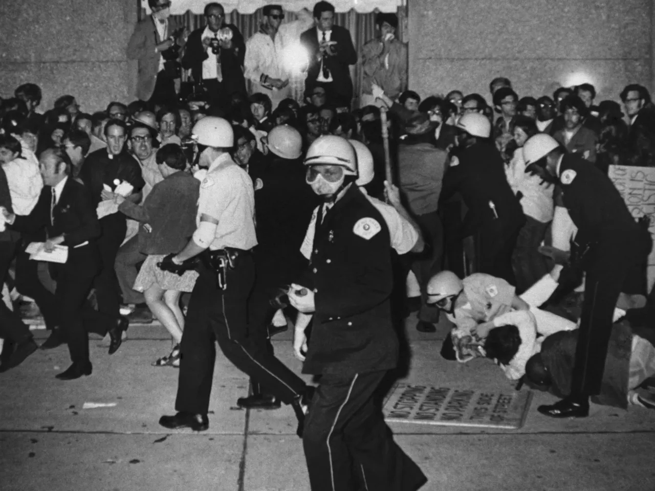 Smoke-filled rooms and pigs for president: Chicago has hosted decades of conventions 4 In this 1968 file photo, Chicago Police attempt to disperse demonstrators outside the Conrad Hilton, which served as the Democratic National Convention headquarters, on Aug. 29, 1968 in Chicago. (AP Photo/Michael Boyer, File)