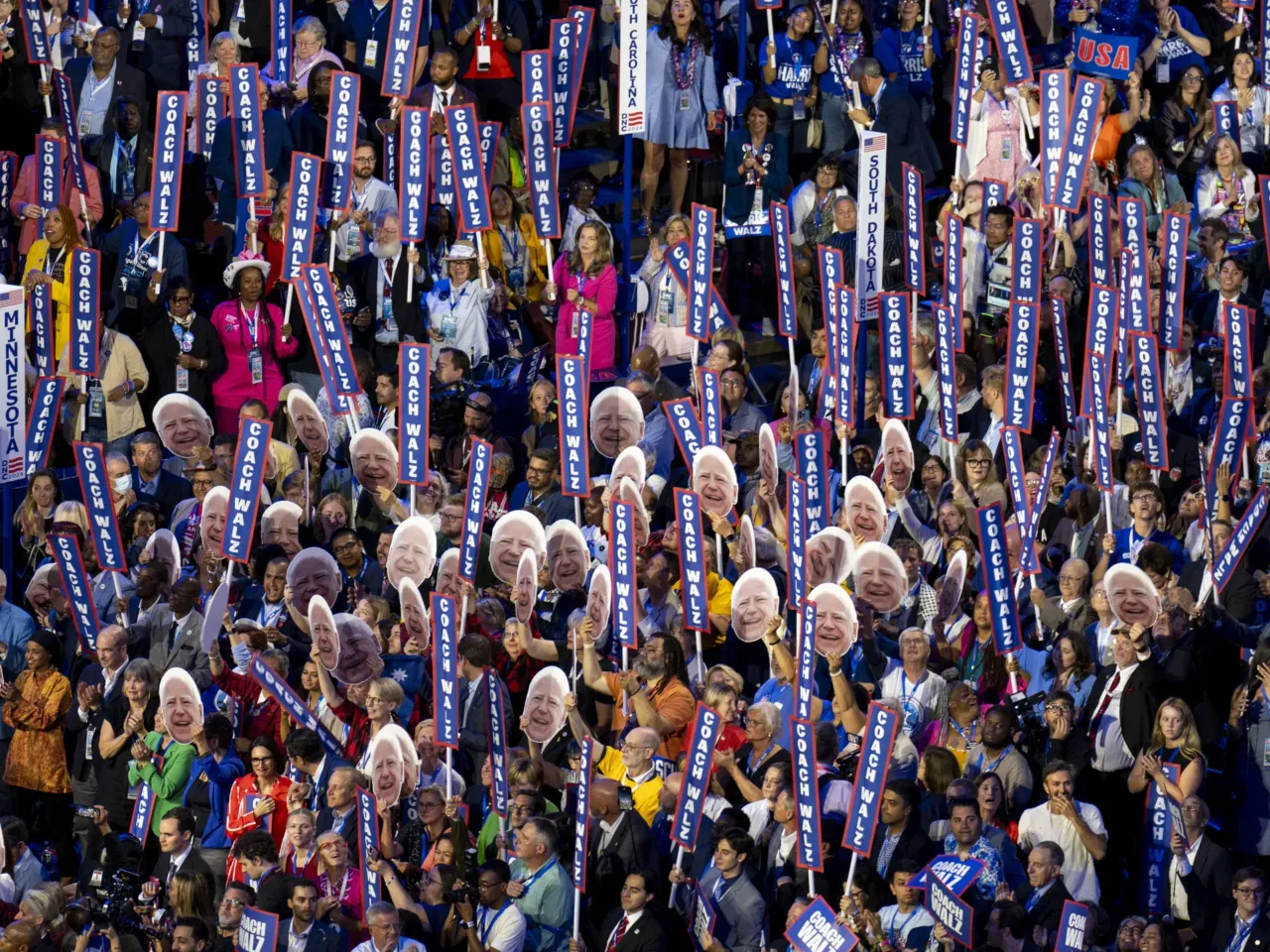 What we saw at the DNC in Chicago 11 Delegates hold up signs reading "Coach Walz" as Minnesota Governor and 2024 Democratic vice presidential candidate Tim Walz speaks on the third day of the DNC.