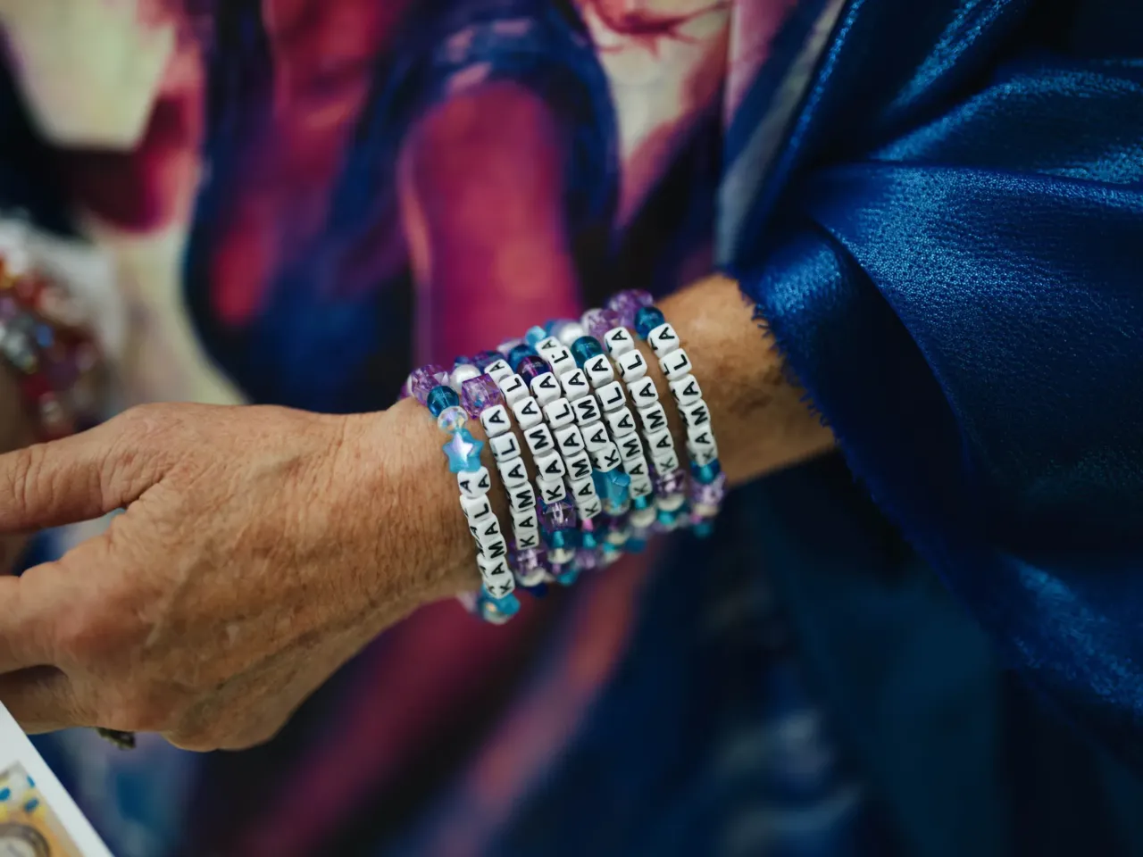 What we saw at the DNC in Chicago 14 Kelly Jacobs wears bracelets that read "KAMALA" that she plans to pass out to people attending the convention.