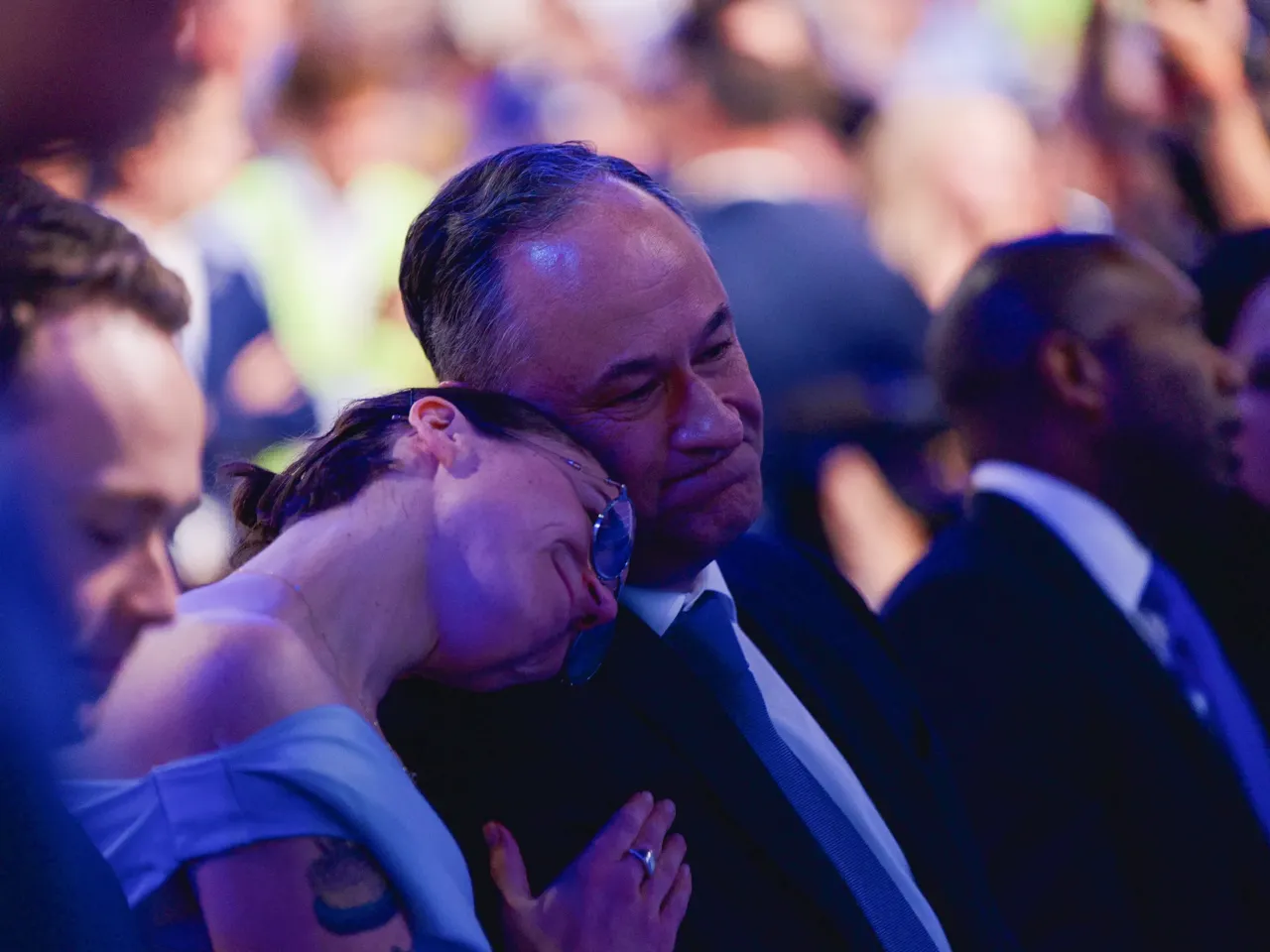 What we saw at the DNC in Chicago 16 Ella Emhoff leans on her father Doug Emhoff's shoulder on the last night of the DNC.