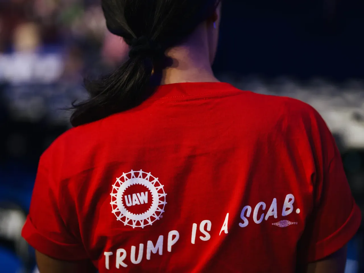 At last week's DNC, even the fashion choices carried political messaging 7 The back of California delegate Sarah Arveson's shirt reads, "Trump is a scab."