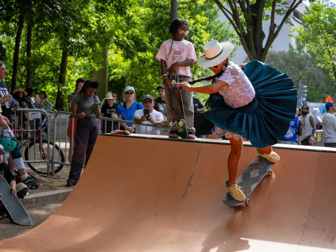 Whatever happened to ... the Bolivian women who skateboard in Indigenous garb? 4 As the Bolivian skateboarders grow older, they try to balance school, work, family — and skateboard practice sessions. Here they are showing the results of their dedication on the ramp at the Smithsonian Folklife Festival.