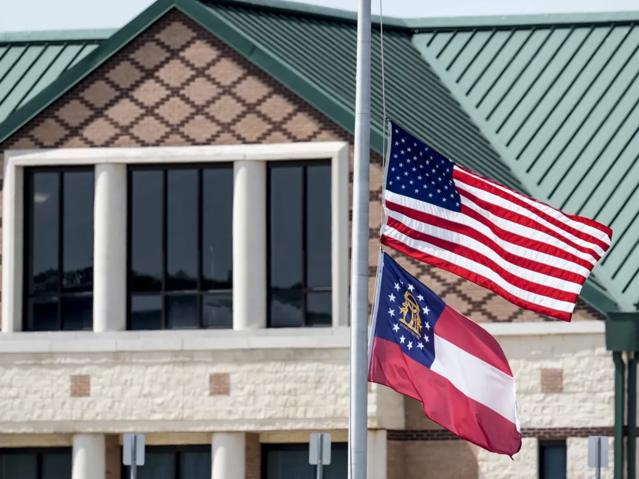 The Georgia high school shooting suspect won't face death penalty, judge says 2 The American and state of Georgia flags fly half-staff on Thursday after a shooting at Apalachee High School in Winder, Ga.