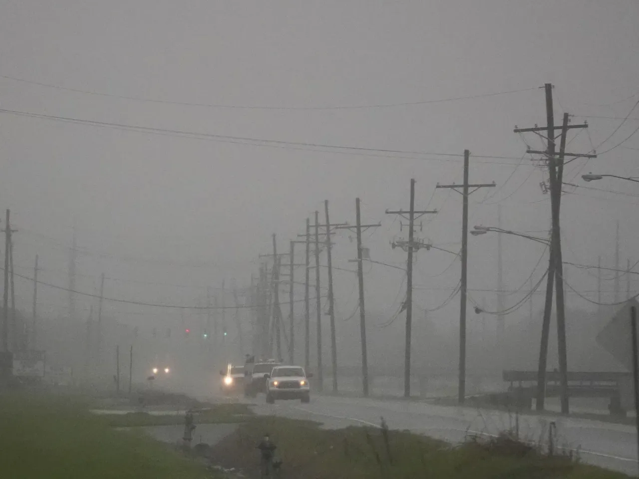 Francine becomes a hurricane as it approaches Louisiana 1 Cars drive through rain bands along Peter Rd., just outside New Orleans, ahead of Hurricane Francine, in Harvey, La., on Tuesday.