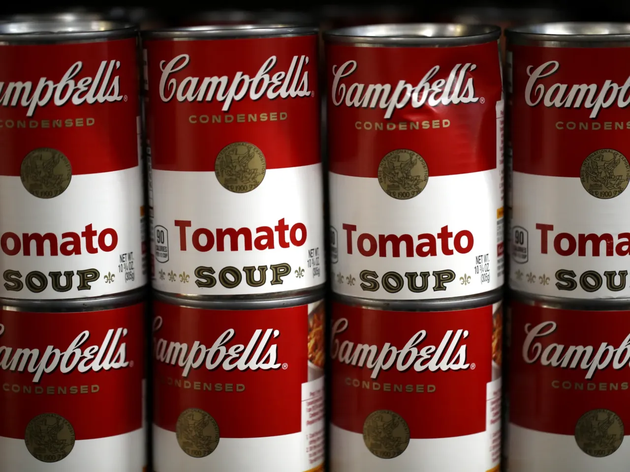 Cans of Campbell's soup are displayed on a shelf at a grocery store in Richmond, Calif., in 2019. The Campbell Soup Company says it's changing its corporate name to The Campbell’s Company.