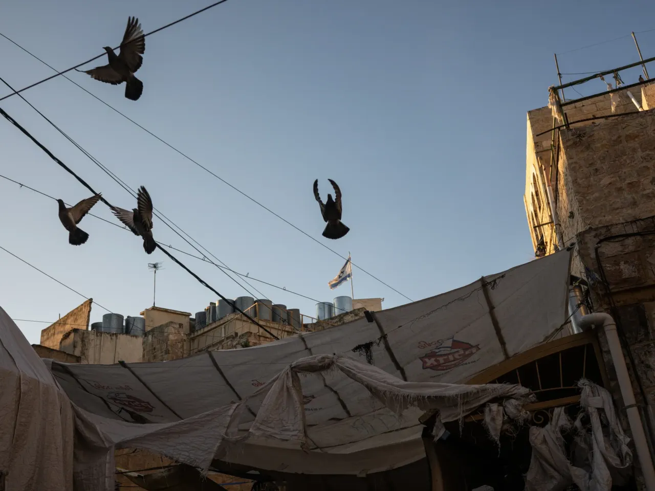 An NPR investigation: A murder in Hebron 9 Buildings in an Israeli settlement stand above a Palestinian street in the old city of Hebron in the occupied West Bank in February.
