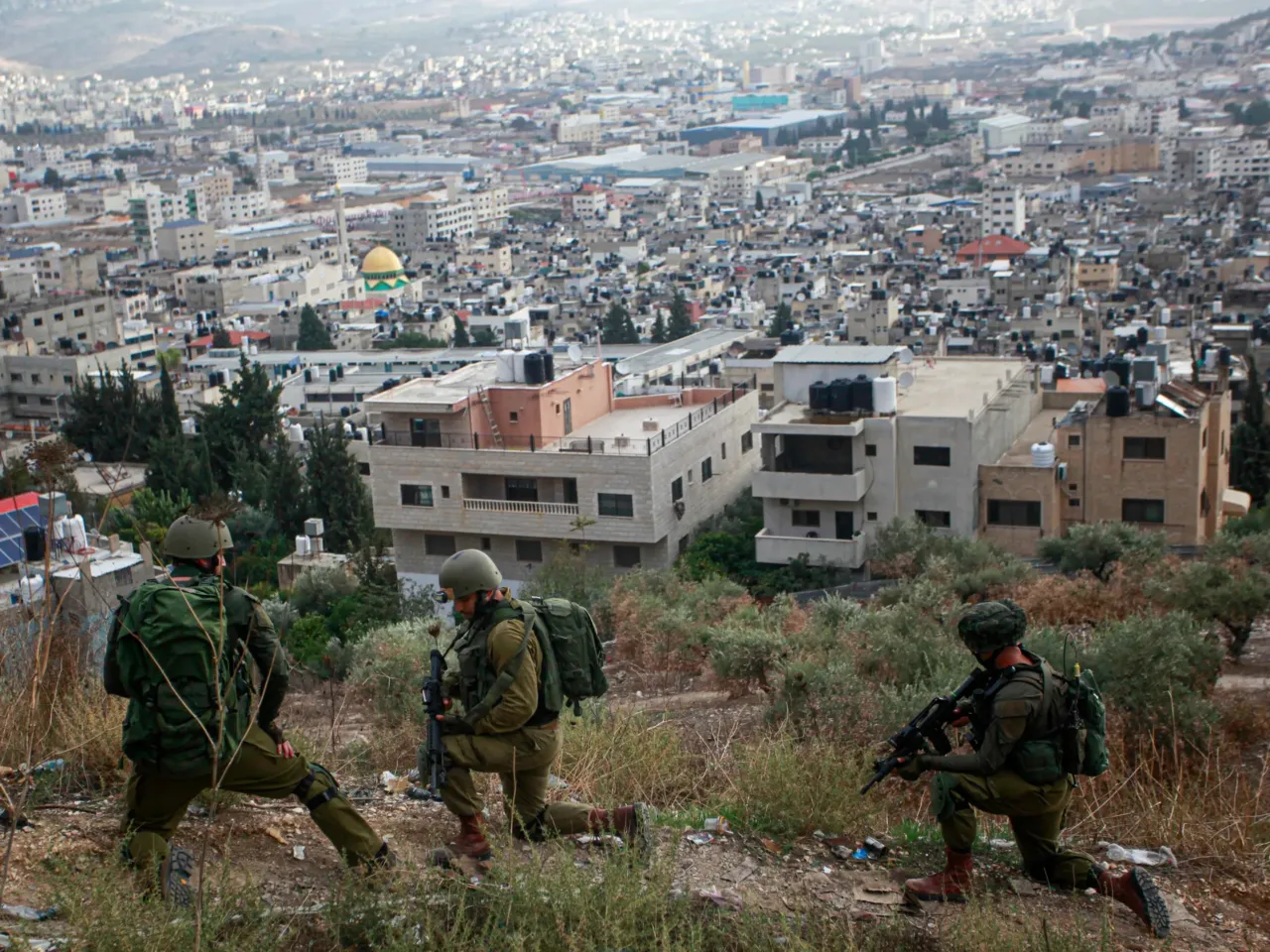 An NPR investigation: A murder in Hebron 12 Israeli soldiers take their positions during a military operation in the Balata refugee camp in the West Bank on Nov. 19, 2023.