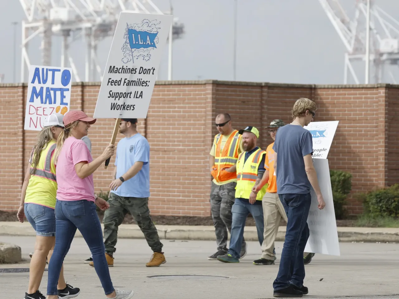 The October surprise: Harris is navigating a pair of them 1 Members of the International Longshoremen's Association picket outside of an entrance to the Dundalk Marine Terminal in the Port of Baltimore on Oct. 3.