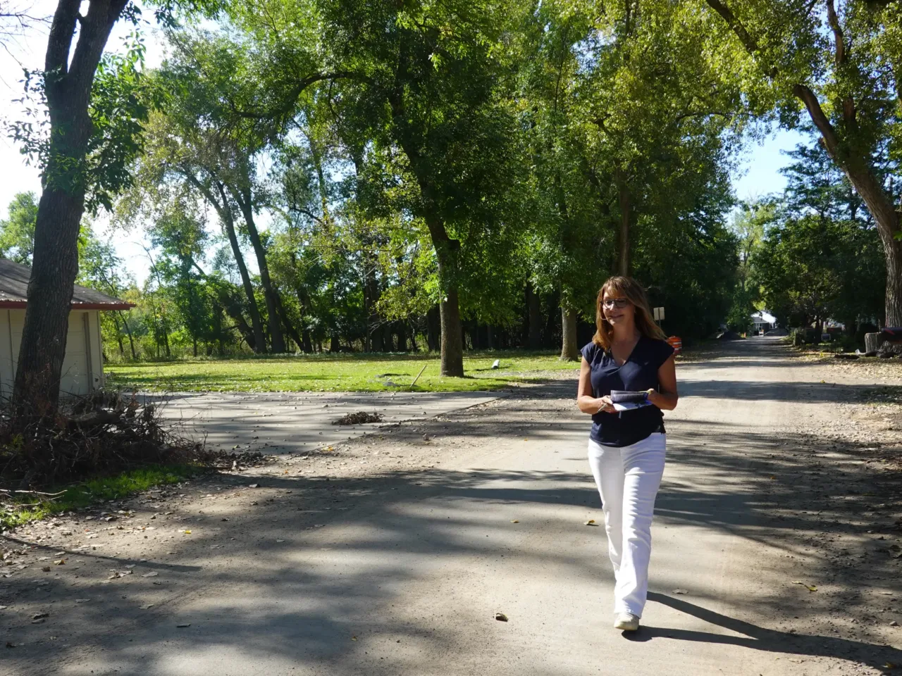 Republican Senate candidate Kathleen Fowke knocks on doors in a key district near Lake Minnetonka ahead of the election in Minnesota.
