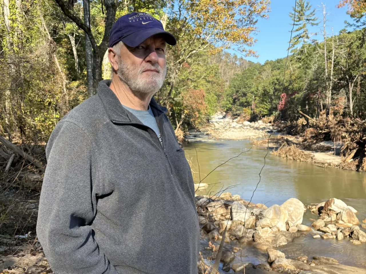 Woody Callaway overlooks the Fish Top access to North Carolina’s Green River, a spot famous for kayaking, rafting and tubing that is now littered with debris and washed-up logs.