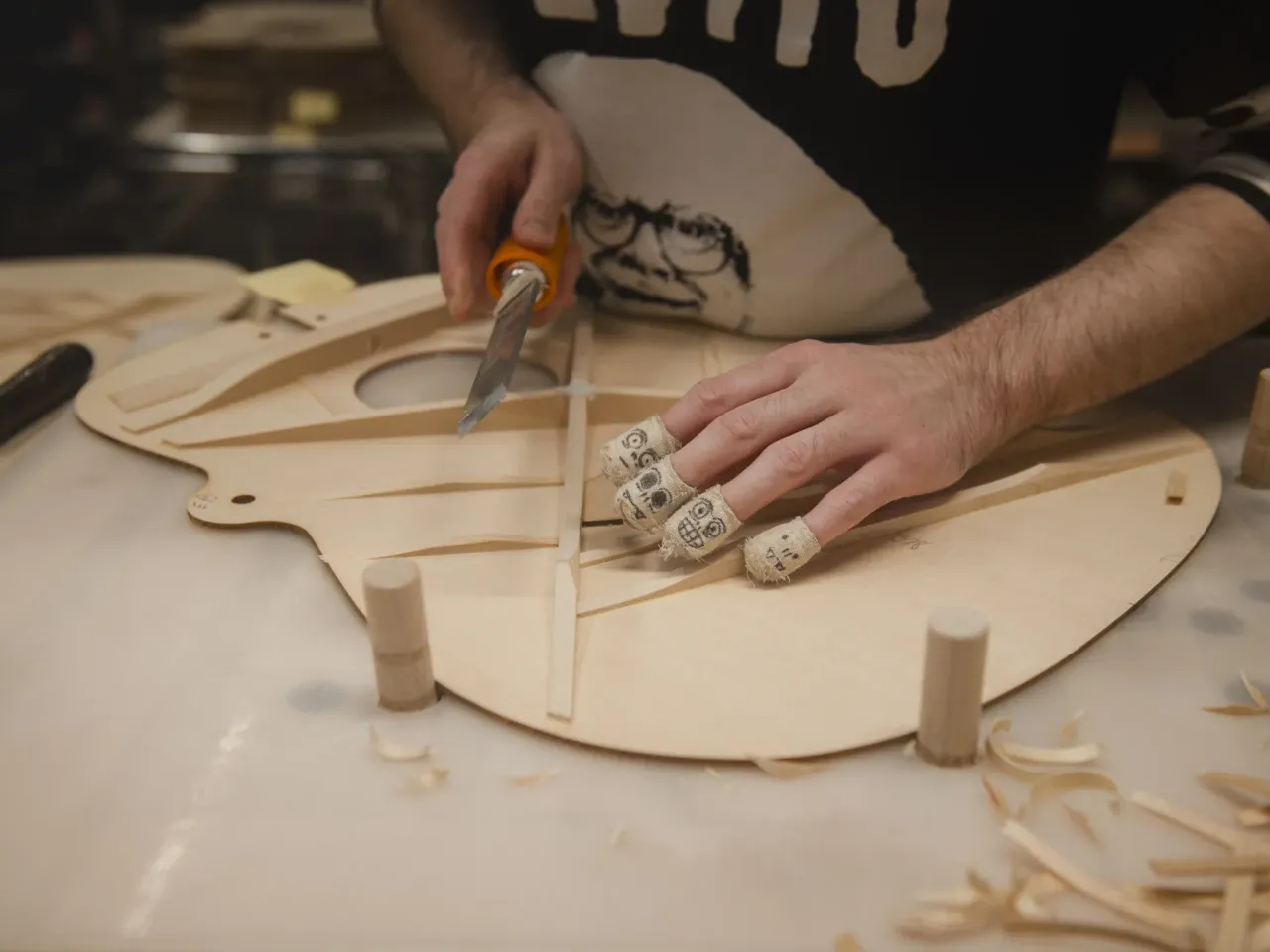 Another reason Pennsylvania is a swing state has nothing to do with the election 4 Ethan Bennett works on shaping back braces of a guitar.
