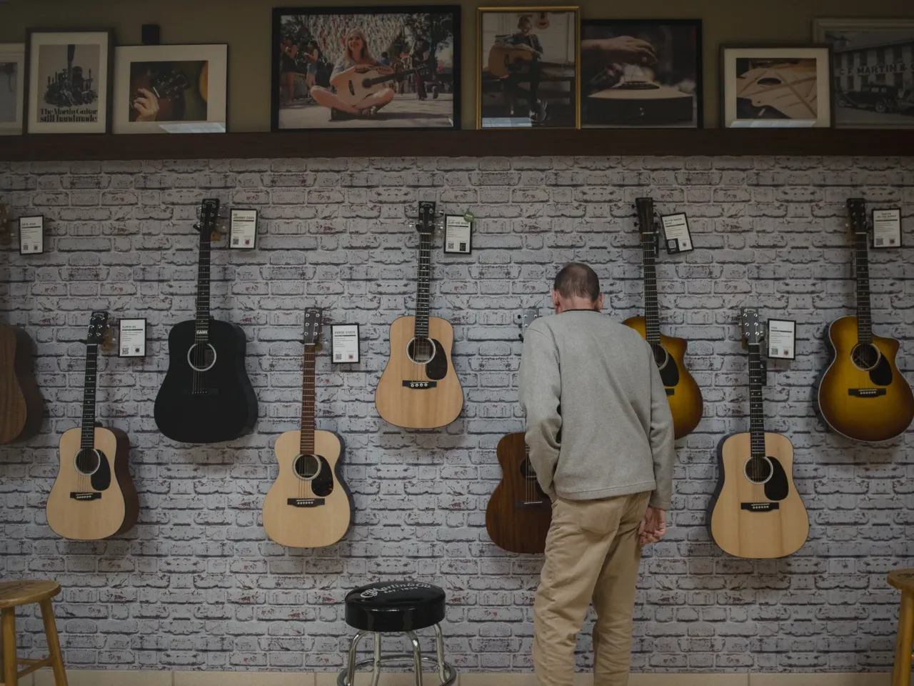 A visitor looks at guitars at the Martin Guitar factory in Nazareth, Pa, on Oct. 15, 2024.