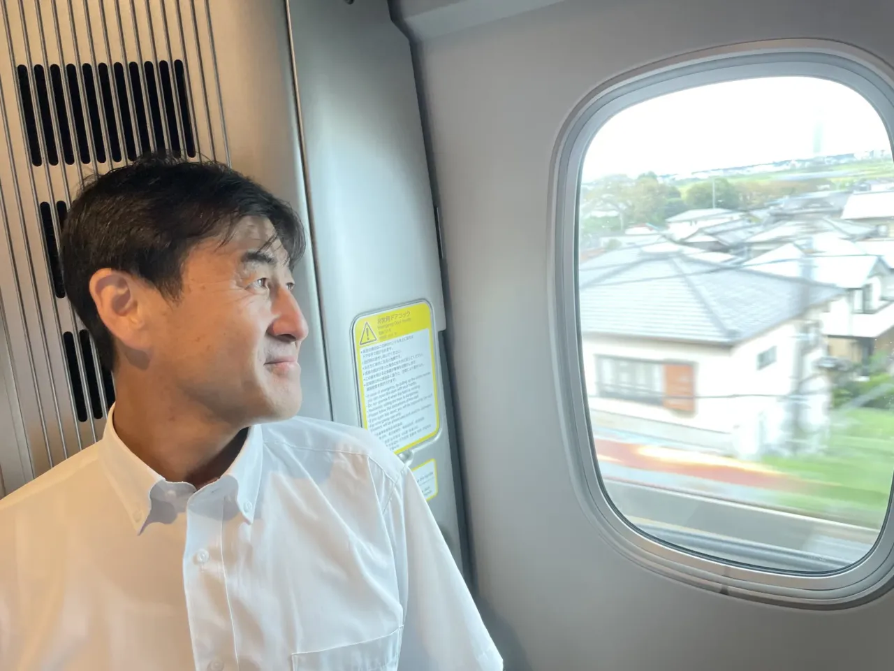 Japan's bullet train just turned 60. Could it finally be coming to America? 1 Naoyuki Ueno with Central Japan Railway Co. watches the Japanese landscape rush by from a window on the Shinkansen on Sept. 28, 2024.