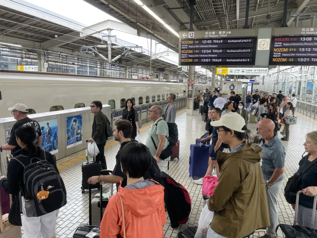 Japan's bullet train just turned 60. Could it finally be coming to America? 2 Passengers prepare to board a Shinkansen train at Kyoto Station on October 4, 2024.