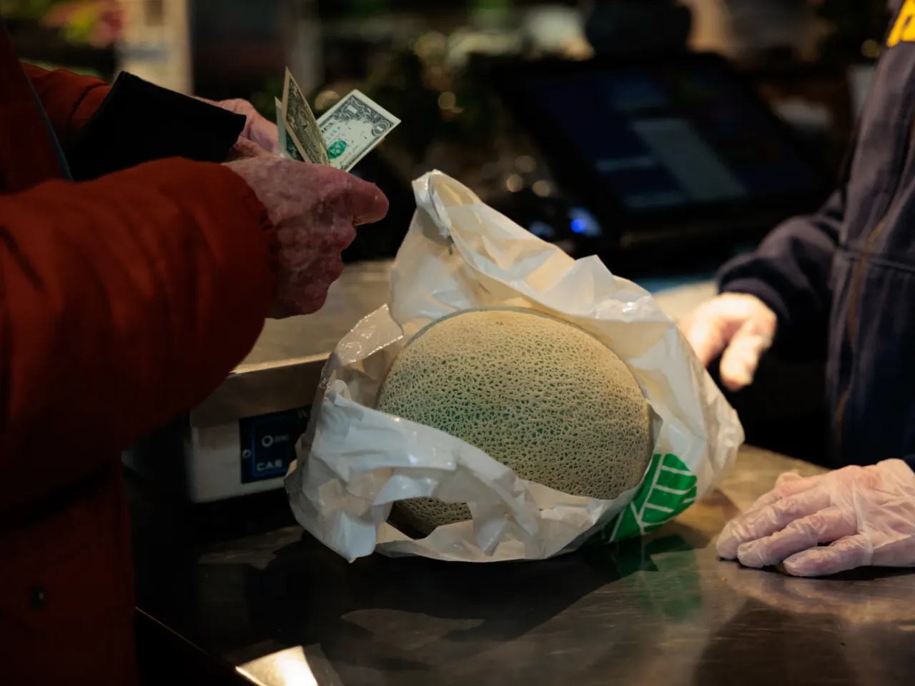 A shopper pays for groceries at the Reading Terminal Market in Philadelphia, Pennsylvania, US, on Feb. 12, 2024. Vice President Kamala Harris and former President Donald Trump have been courting swing voters in the battleground state of Pennsylvania.