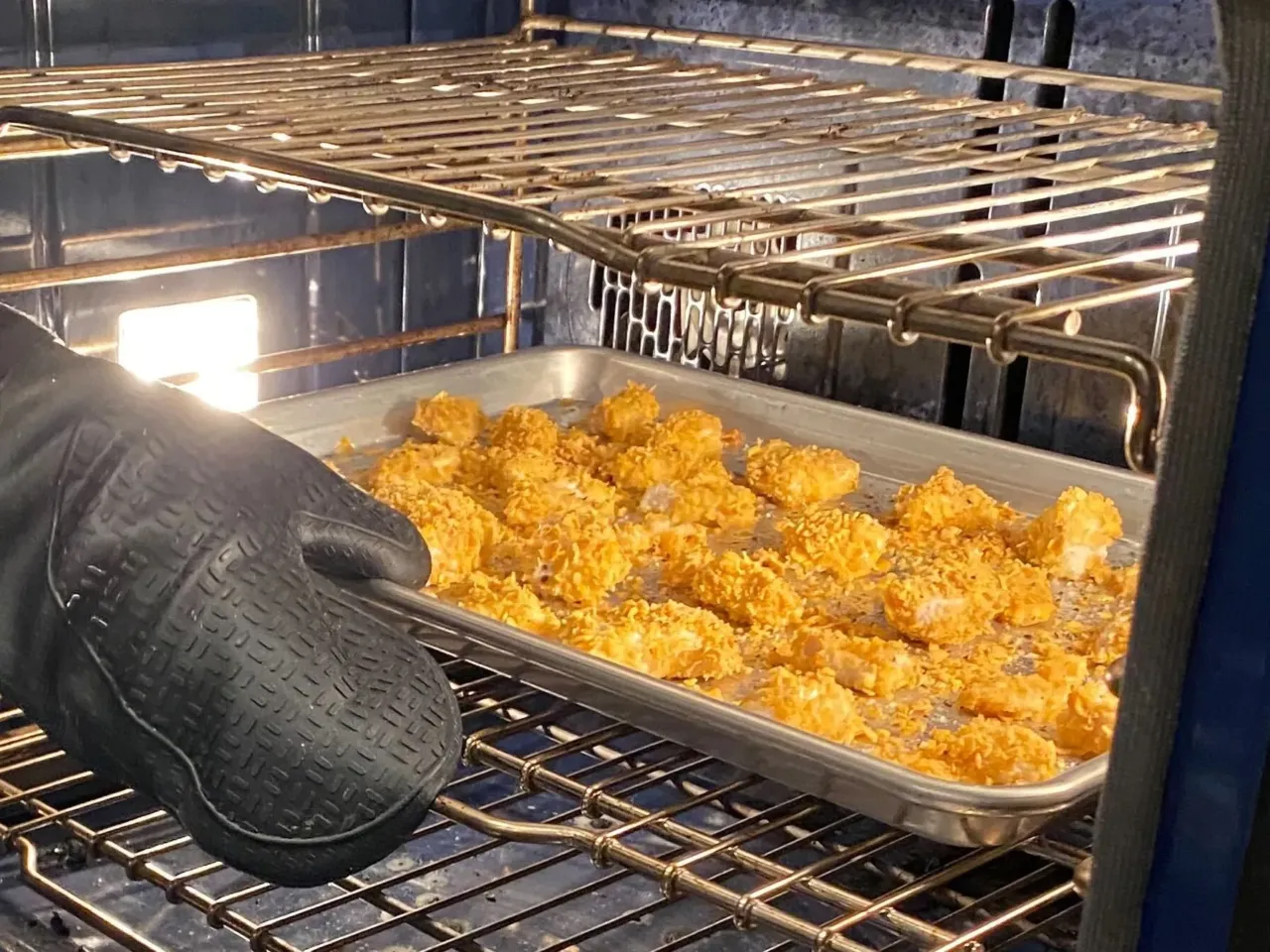 Get your kids in the kitchen with hands-on recipes 2 "Chicken Mark Nuggets" coming out of the oven.