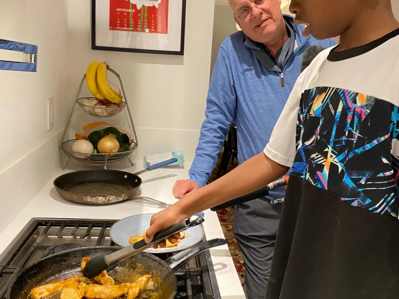 Get your kids in the kitchen with hands-on recipes 4 Ayesha Rascoe's son, Reggie (11), sautés chicken with help from Mark Bittman.