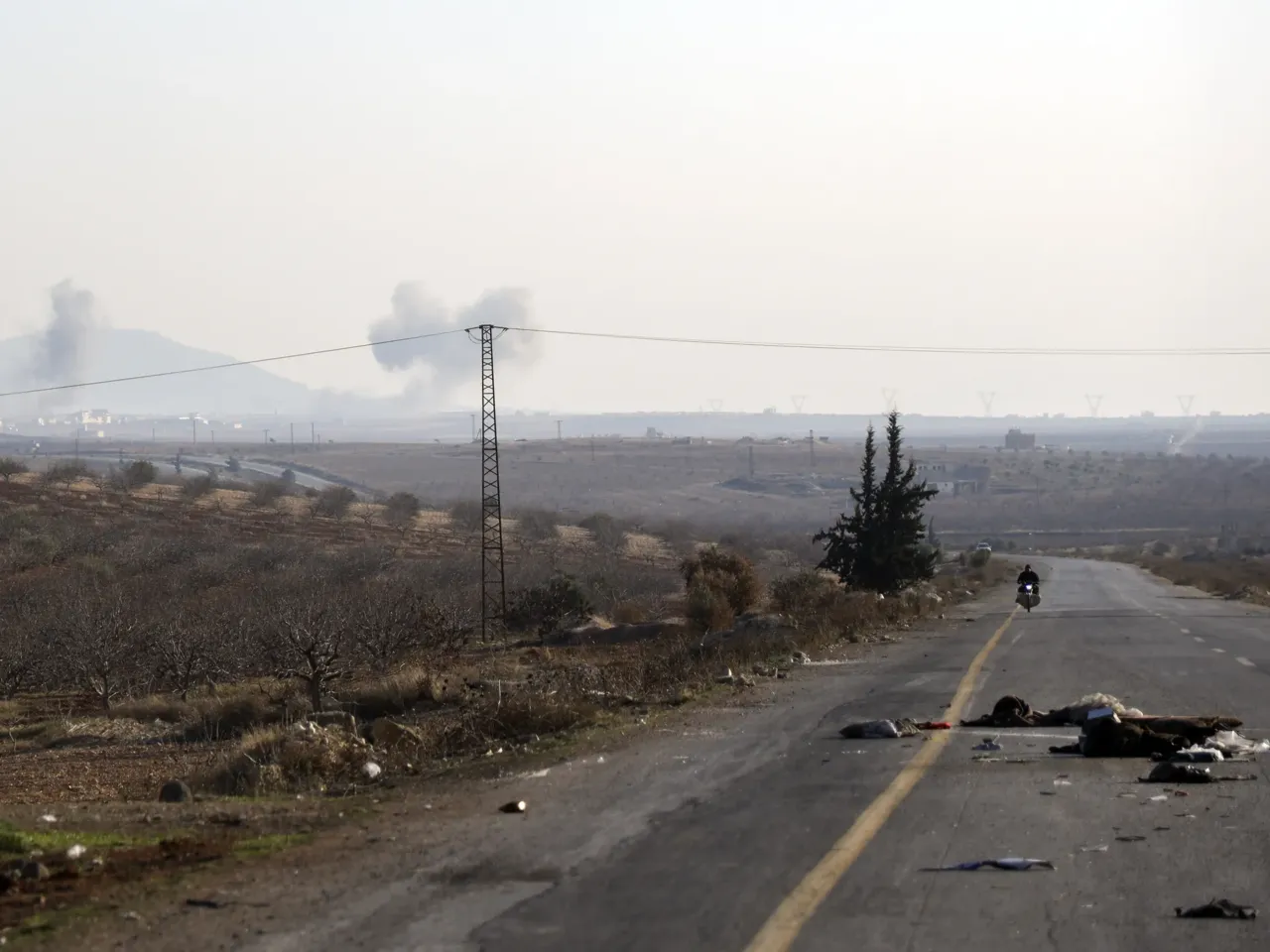 Smoke from fighting billows in the edges of the town of Hama, Syria, Tuesday Dec. 3, 2024.