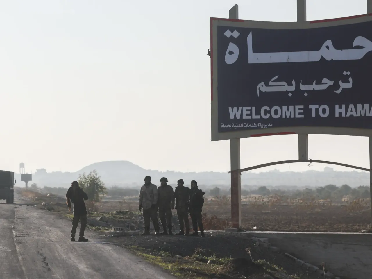 Syrian opposition forces enter the key city of Hama, in a new blow to Assad's regime 1 Syrian opposition fighters take pictures in the outskirts of of Hama, Syria, Tuesday Dec. 3, 2024.