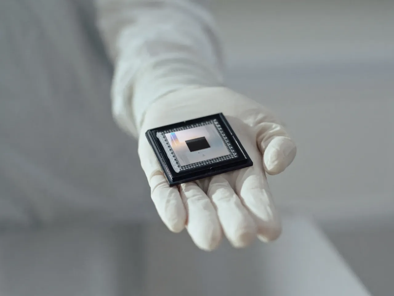 A person shows Google Quantum AI's "Willow" chip, in this undated handout photo obtained by Reuters on December 6, 2024.