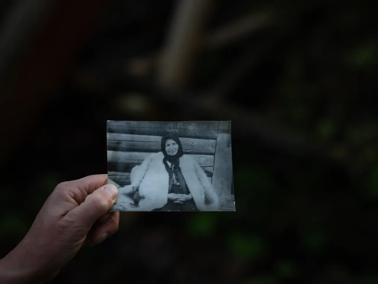 Olha Mys shows a photo of her grandmother wearing a hunia. The tradition of crafting the coats has been in the family for generations.