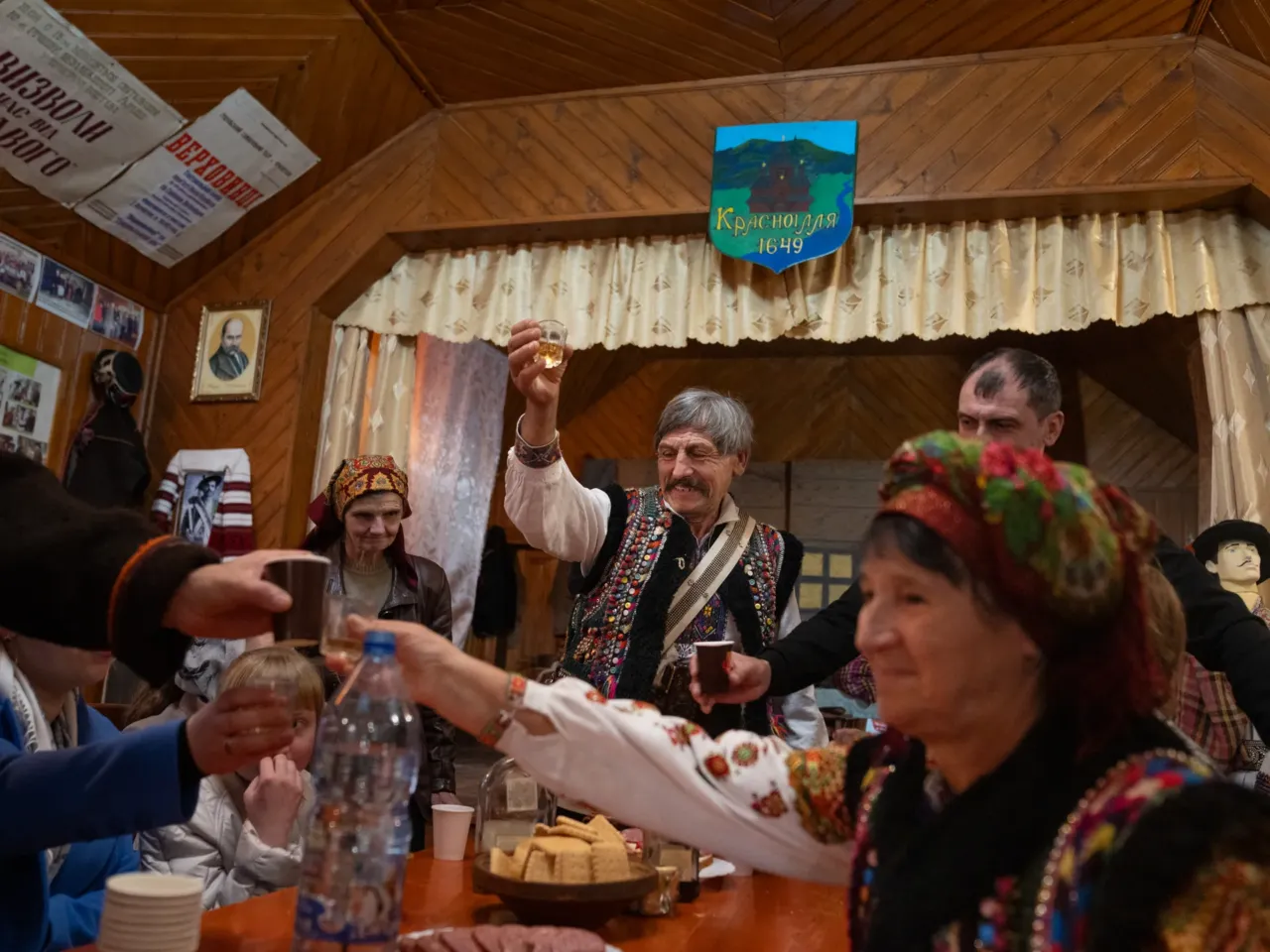 After rehearsal, the theater troupe has drinks and shares some meats and cheeses together.