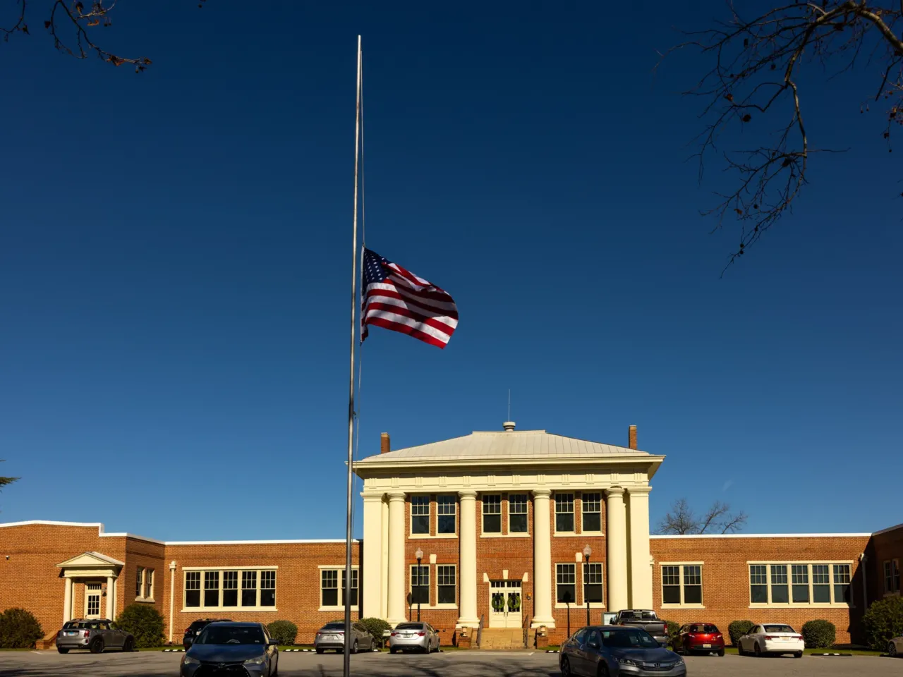 In Jimmy Carter's hometown of Plains, people remember the former president 3 A flag flies at half-staff in front of the Plains High School visitor center on Monday. Across the United States, flags will remain lowered for the next 30 days to honor the former president.