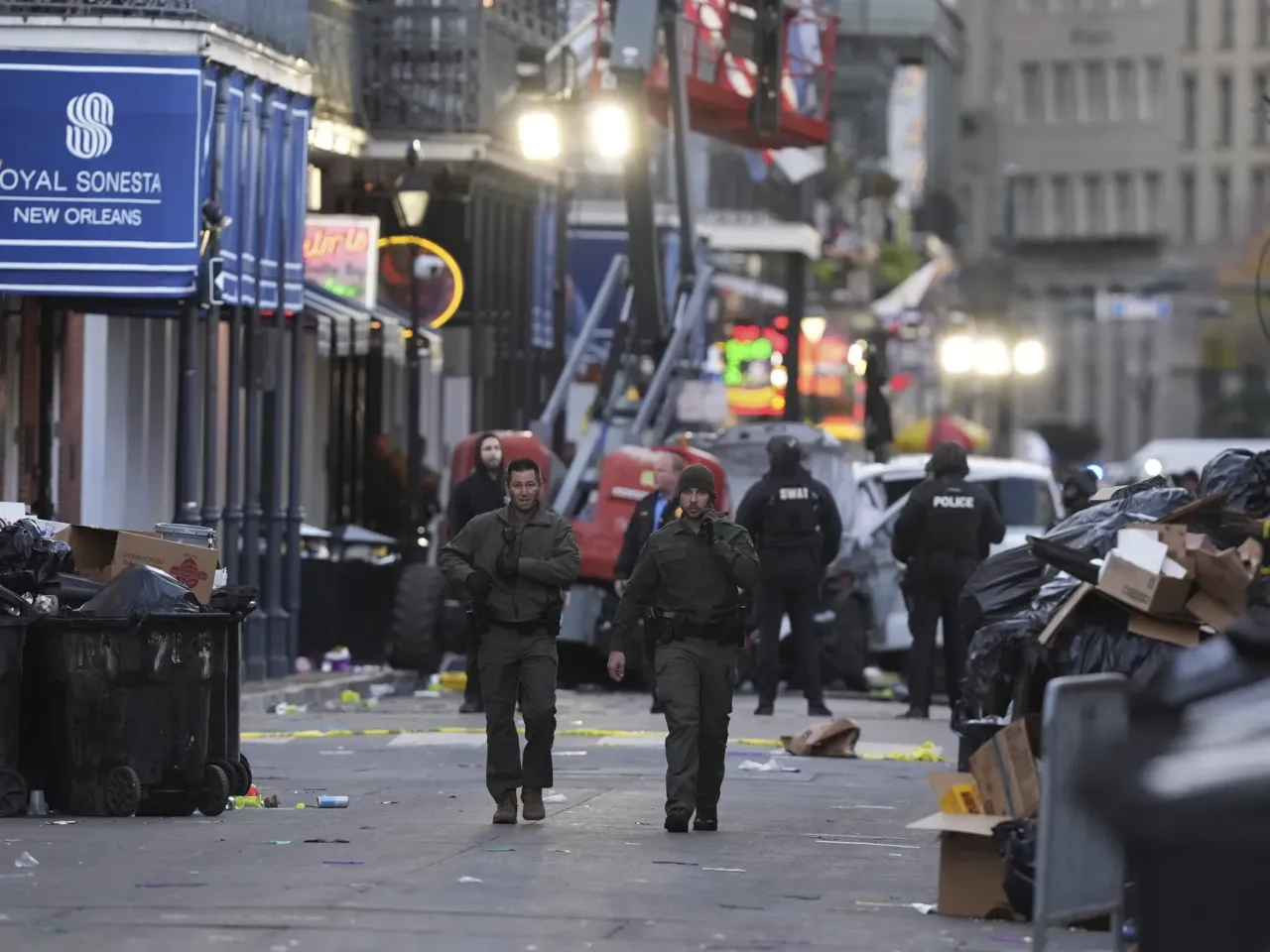 Emergency services attend the scene after a vehicle drove into a crowd on New Orleans' Canal and Bourbon Street.