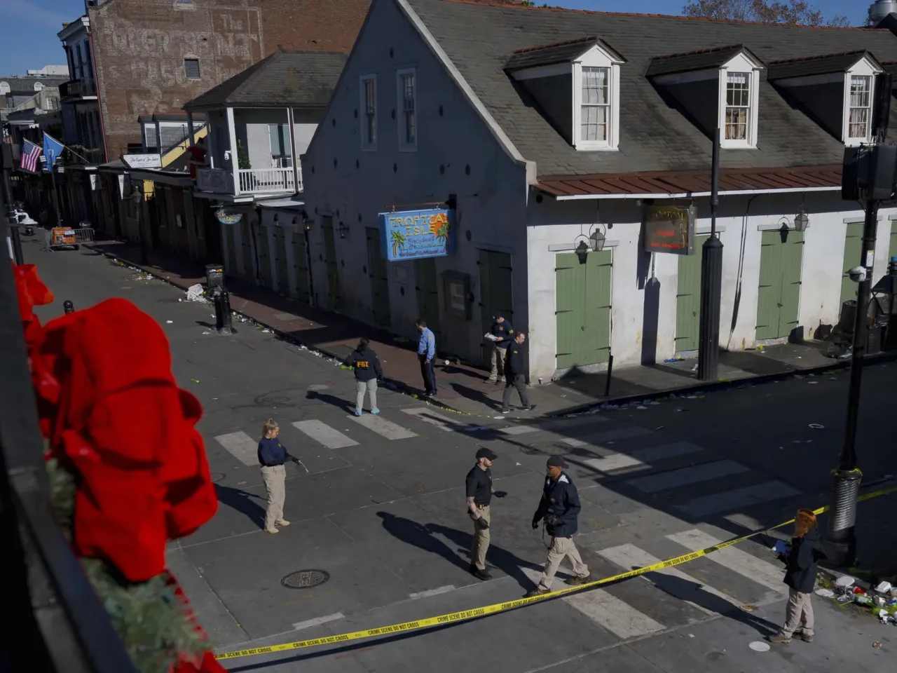 Members of the FBI walk around Bourbon Street during the investigation of a truck fatally crashing into pedestrians on Bourbon Street.